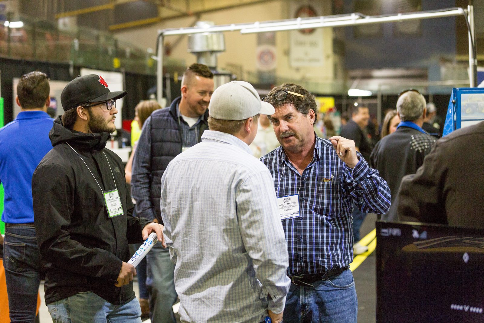 Industry professionals in conversation at the BOAGS show floor