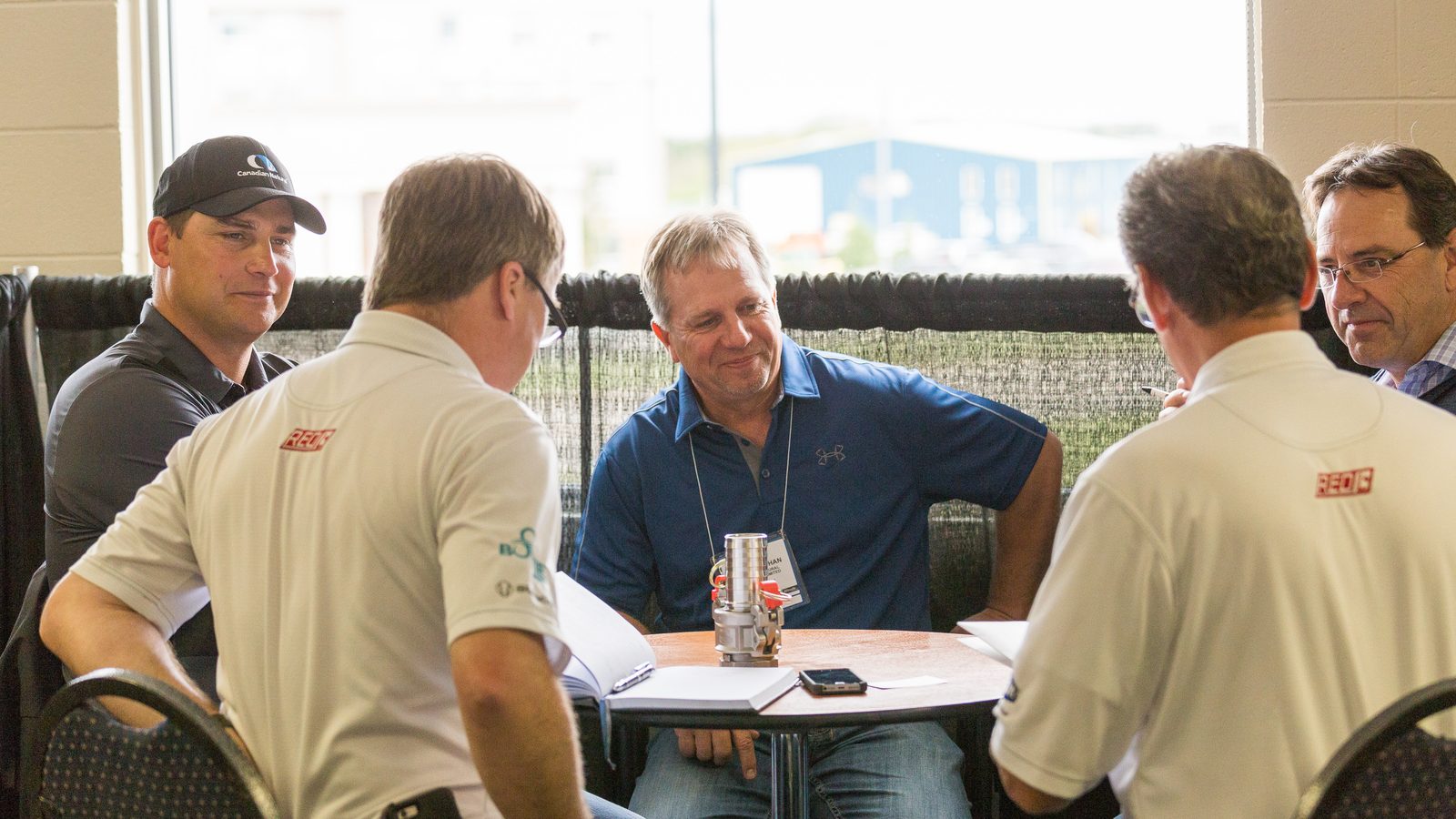 Industry professionals meeting at the BOAGS show floor